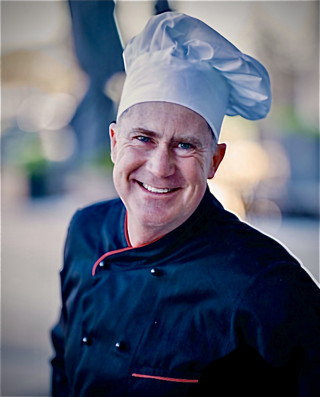 Completed paella dish with colorful peppers and seafood